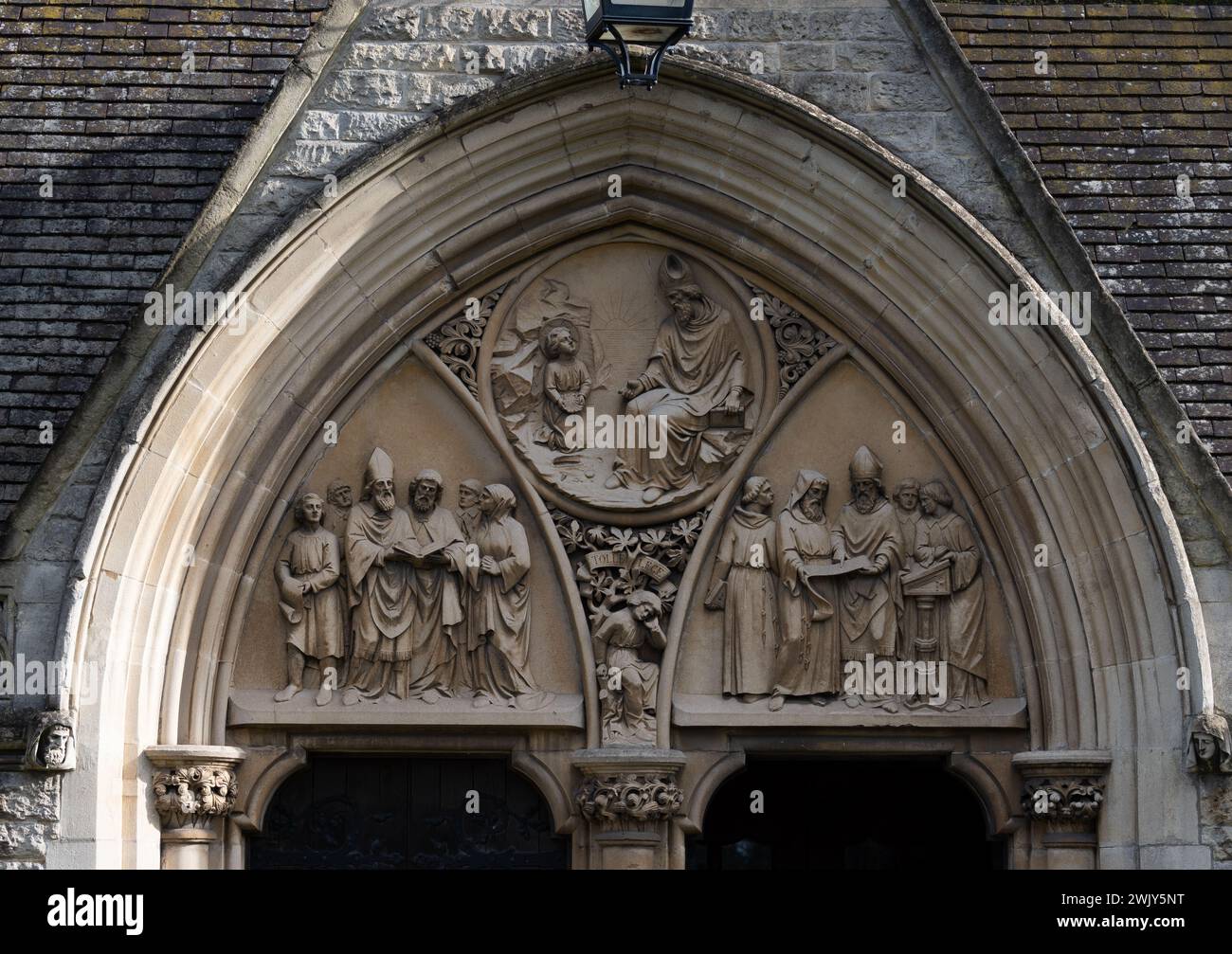Entrance porch tympanum, St. Augustine`s Church, Edgbaston, Birmingham, West Midlands, England, UK Stock Photo